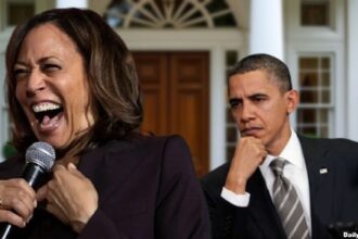 Barack Obama staring angrily at Kamala Harris.