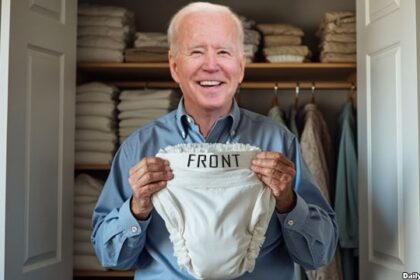 Joe Biden holding a diaper inside of his bedroom.