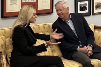 Two ladies Lindsey Graham and Pam Bondi gossiping inside Senate office.