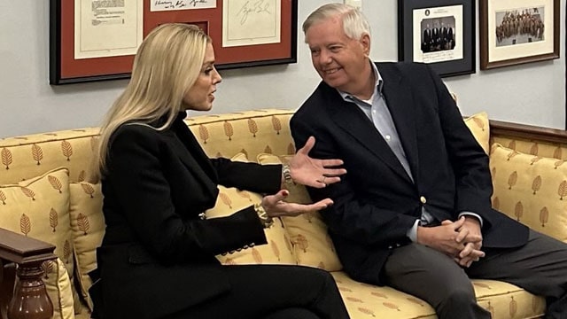 Two ladies Lindsey Graham and Pam Bondi gossiping inside Senate office.