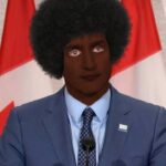 Justin Trudeau wearing blackface.