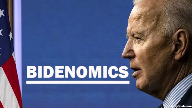 Joe Biden in front of a Bidenomics sign.