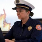 Los Angeles L.A. Fire Chief sitting at her desk