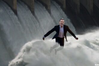 Gavin Newsom standing in front of California dam Trump opened up.