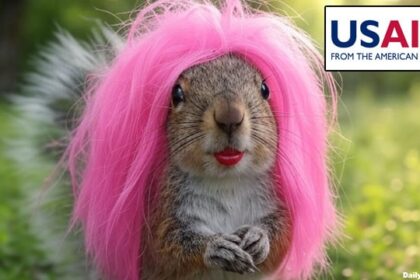 Transgender squirrel with pink hair and red lips in Guatemala waiting for a USAID payment.