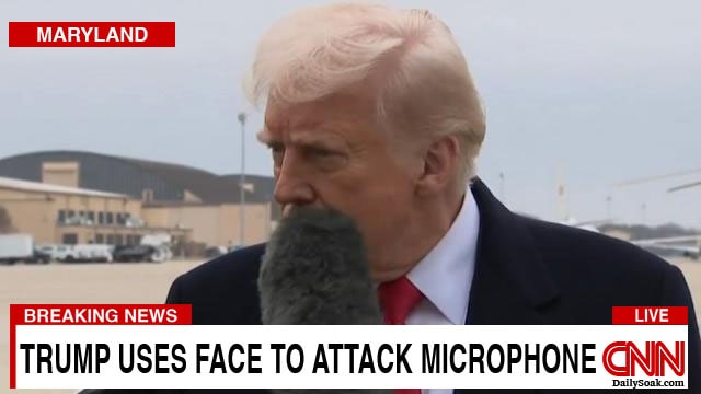 CNN news reporter's microphone hitting Donald Trump in the face.