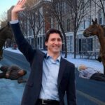 Justin Trudeau on last day as prime minister receiving a 21-horse trampling salute.