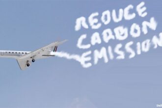 Bernie Sanders private jet in sky contrails spelling out word "Reduce Carbon Emissions."
