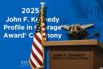 Fly that landed on Mike Pence's head sitting on podium.