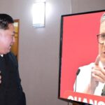 Kim Jong Un watching UK Prime Minister Keir Starmer on TV.