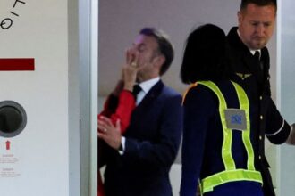 Emmanuel Macron getting punched in the face by wife Brigitte for leaving toilet seat down.