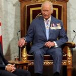 Mark Carney sitting at the feet of King Charles in Canada.