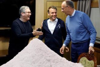 UK's Keir Starmer, Emmanuel Macron, and Friedrich Merz with coke on train.