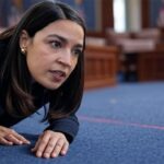 AOC in Congress chasing a red laser pointer like a cat.