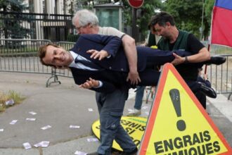 Wax statue of French President Emmanuel Macron being stolen by Greenpeace activists.