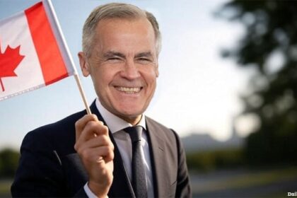 White male Mark Carney wearing a suit and waving a Canada flag.
