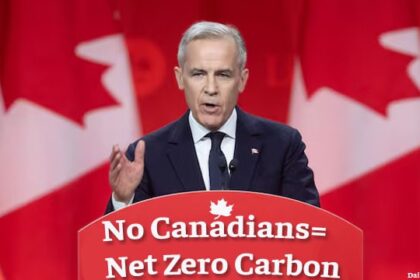 Canada Prime Minister Mark Carney on stage for speech about net zero carbon.