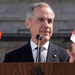 Mark Carney giving a speech on stage with a Canada flag and India flag.