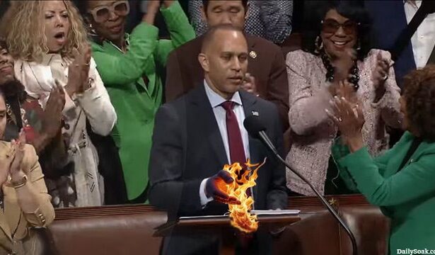 Democrat Hakeem Jeffries hand catches fire after touching Constitution inside Congress.