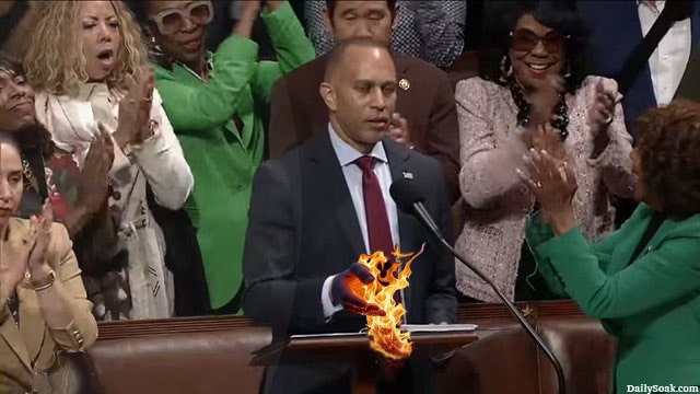 Democrat Hakeem Jeffries hand catches fire after touching Constitution inside Congress.