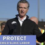 Gavin Newsom giving a speech in front of a podium on Donald Trump's ICE raids.