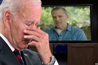 Joe Biden covering his eyes while watching his male son Hunter Biden on a television.