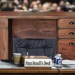 Pam Bondi's desk sitting behind witness table inside of Congress.