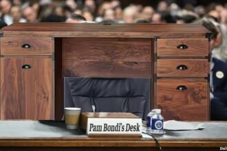 Pam Bondi's desk sitting behind witness table inside of Congress.