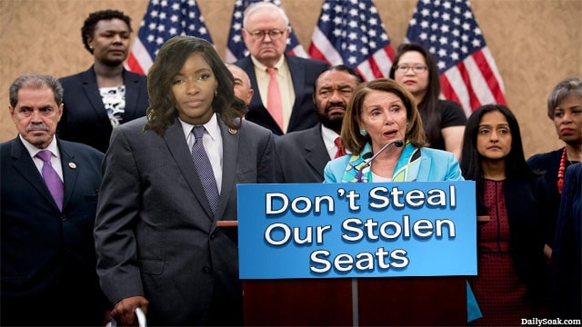Male and female Democrats in Congress standing behind podium to protest Trump's census.