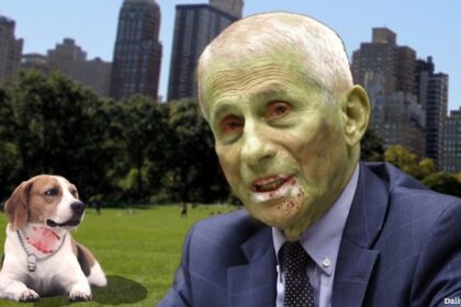 Dr. Fauci in a park next to a beagle dog.