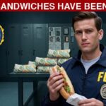FBI agent inside of an FBI evidence room with dozens of Subway sandwiches on a table in middle of room.