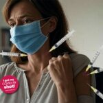 Liberal white woman in a doctor's office getting injected with the COVID vaccine after RFK Jr. banned vaccines.