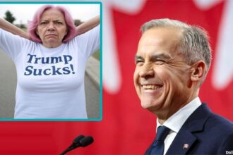 Canada Prime Minister Mark Carney on stage laughing at a pink-haired Canadian woman.