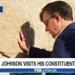 Republican Mike Johnson touching the Wailing Wall in Israel.
