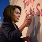 Nancy Pelosi spray-painting a wall of the Capitol Building.