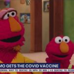 Sesame Street's Elmo getting the COVID vaccine.