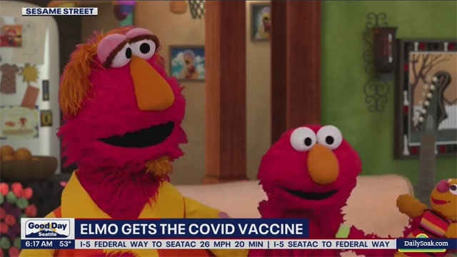 Sesame Street's Elmo getting the COVID vaccine.