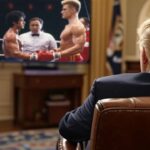President Donald Trump sitting inside the Oval Office watching Rocky IV on a television.