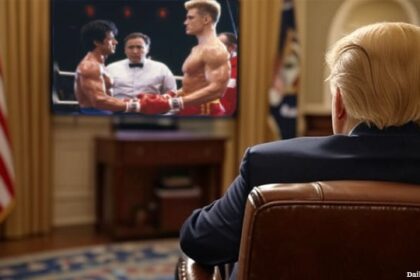 President Donald Trump sitting inside the Oval Office watching Rocky IV on a television.