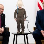 Ukraine President Zelensky standing on a table in the middle of a seated Russian President Putin and President Donald Trump.