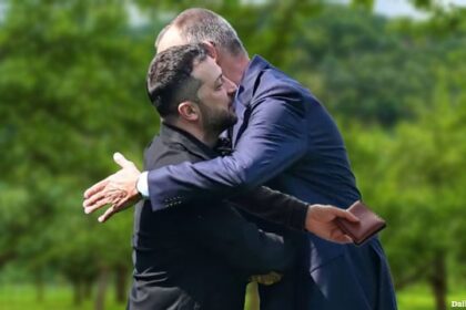 Ukraine President Zelensky hugging German Chancellor Friedrich Merz.