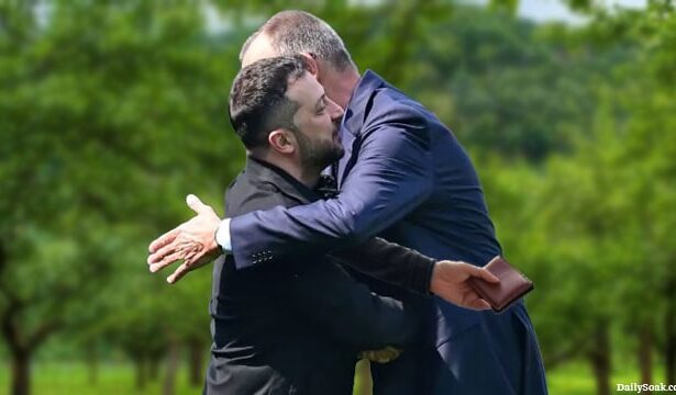 Ukraine President Zelensky hugging German Chancellor Friedrich Merz.