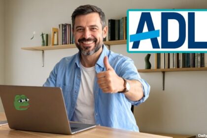 White man looking at a laptop on desk checking on ADL website.