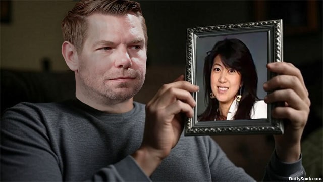 Male California Democrat Eric Swalwell sitting on a couch staring a picture frame with Asian woman Fang Fang in it.