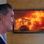 Gavin Newsom watching footage of the California wildfires.