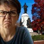 Angry, white liberal woman wearing eyeglasses standing in Washington DC after president Trump cleaned it up.