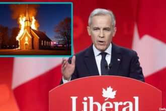 White male Canada Prime Minister Mark Carney speaking on stage in front of an image of a burning church.