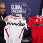 Canada's Mark Carney and UK's Keir Starmer on stage holding hockey jerseys.