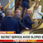 Secret Service agents watching as President Donald Trump gets stuck on sloped escalator in UN building.