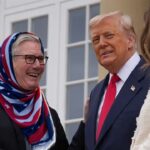 UK Prime Minister Keir Starmer wearing an American flag Islamic hijab as he shakes the hand of President Donald Trump.
